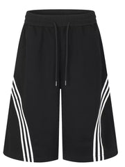 Black wide-leg cropped sweatpants with drawstring waist and white side stripe detail.