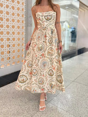 Vintage floral midi dress with spaghetti straps and a-line cut in apricot.