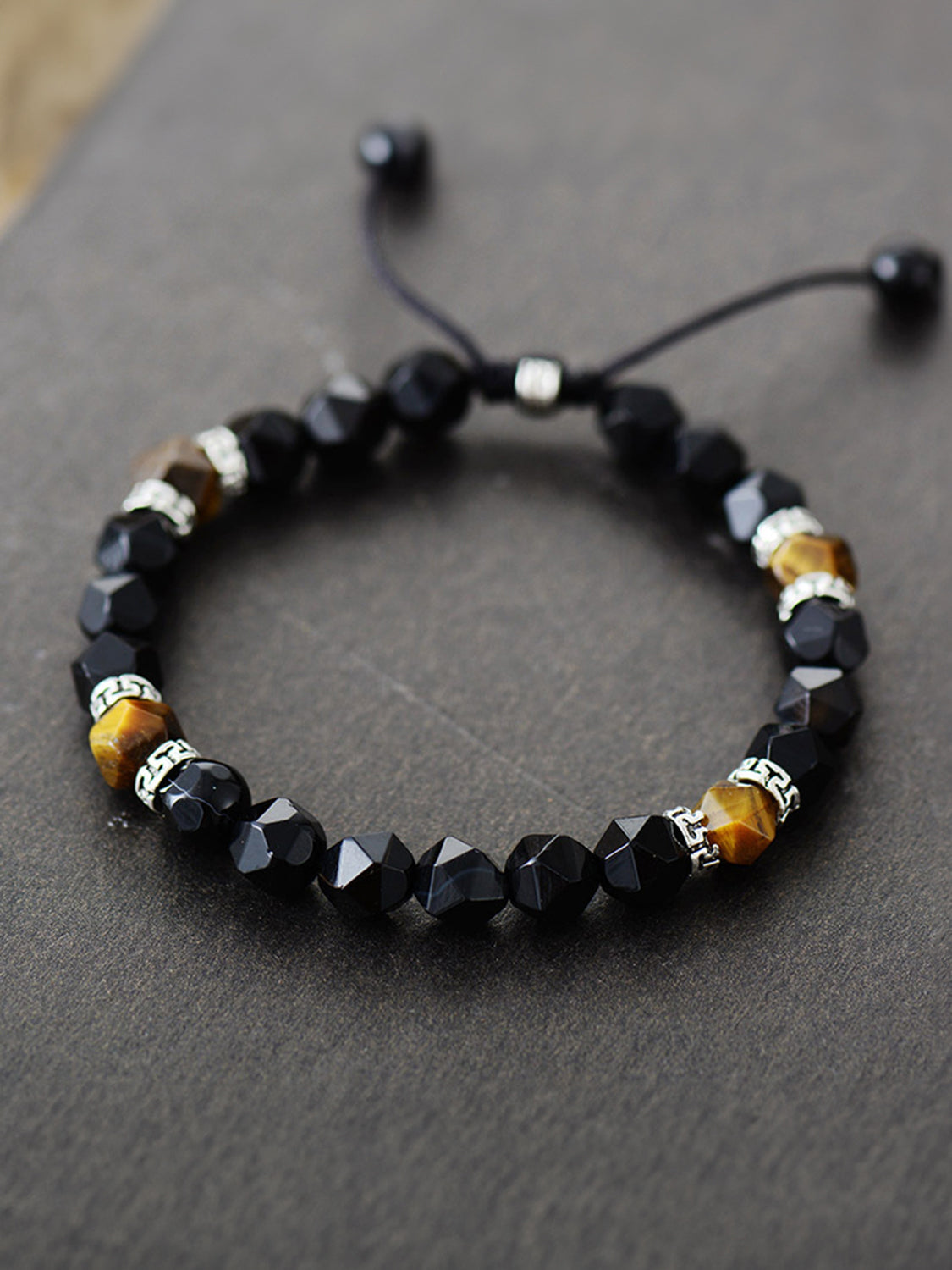 Black agate and tiger's eye bead bracelet with adjustable cord and silver accents