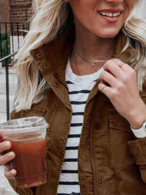 Brown utility jacket with zip and button closure, featuring chest pockets and a collared neckline.