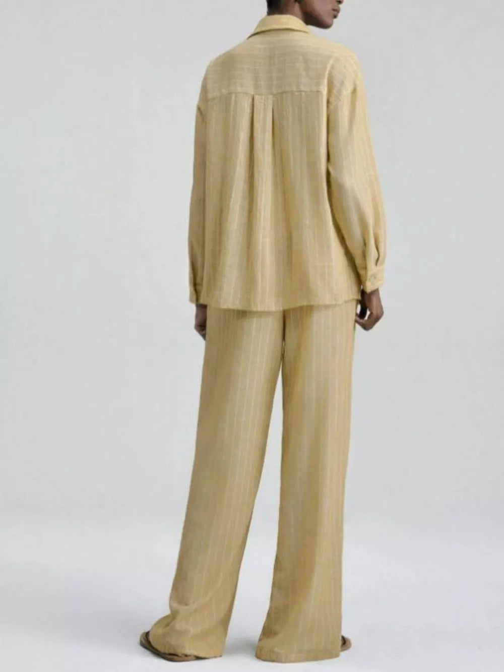 Chic striped two-piece set with button-down shirt and wide-leg pants in tan.