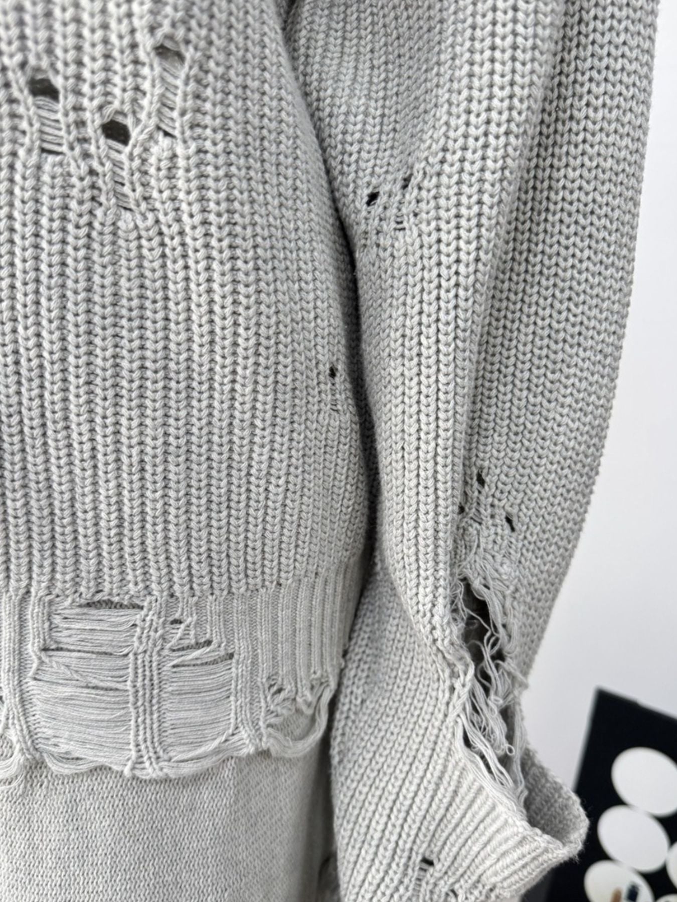 Light gray distressed cotton sweater set with deconstructed details and ripped accents.