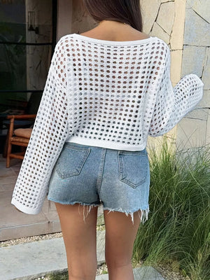 White crochet knit boat neck sweater cover-up with open knit detail and long sleeves.