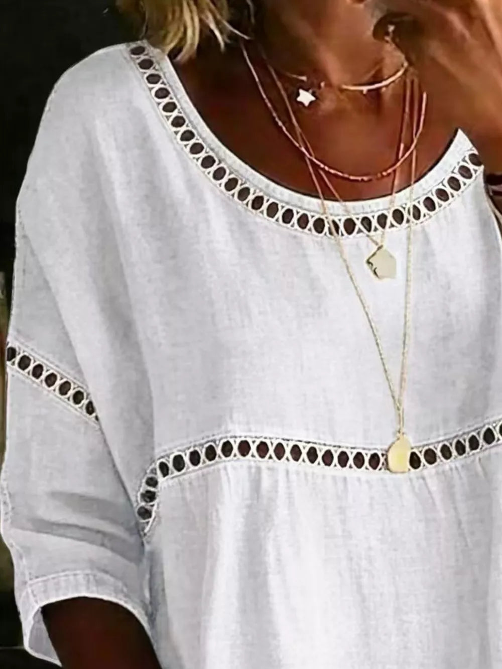 White bohemian t-shirt with openwork floral detail at neckline and waist
