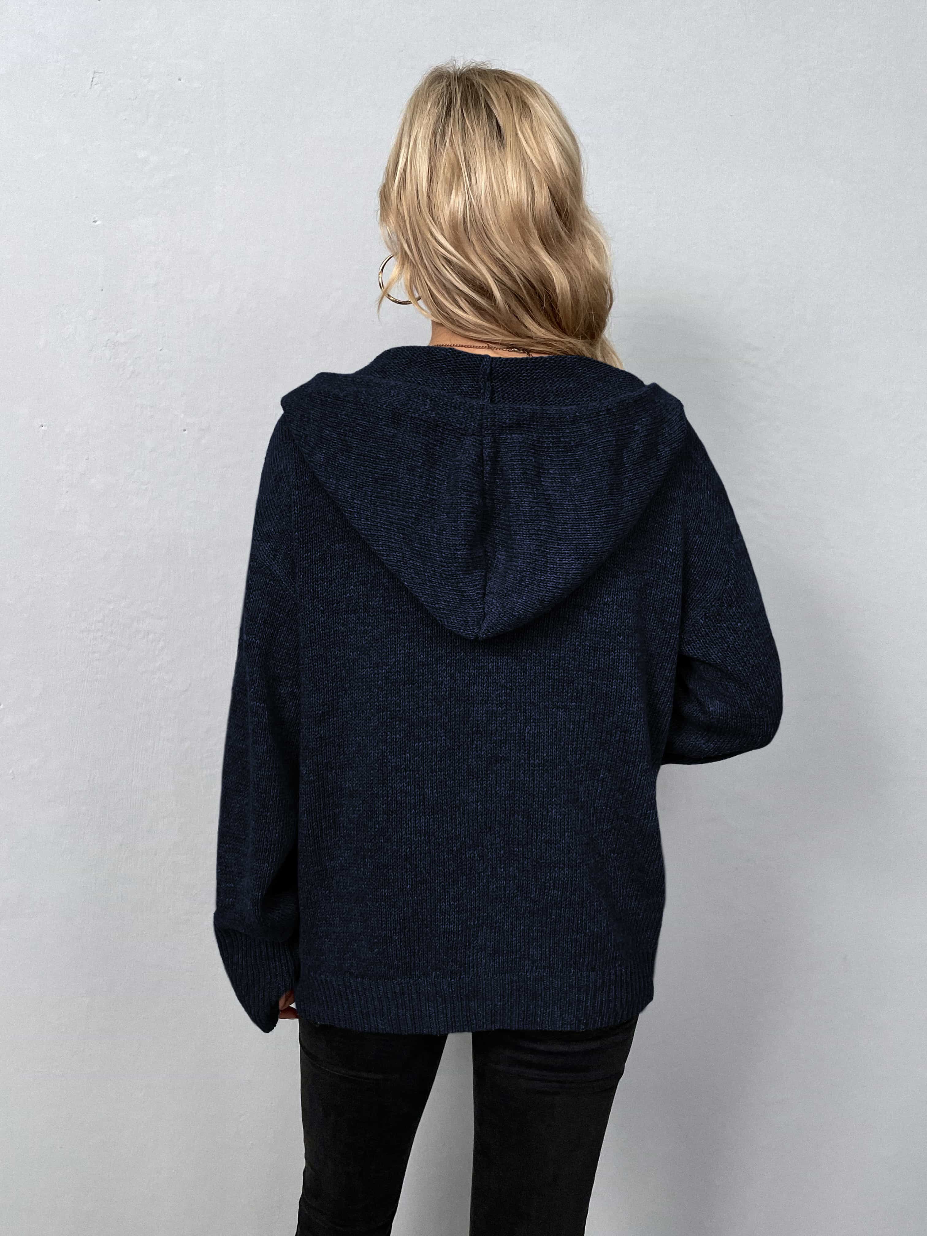 Dark blue hooded knit cardigan with button front, shown from the back.