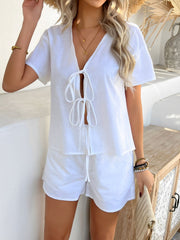 White linen tie-front top and shorts set with short sleeves and v-neckline