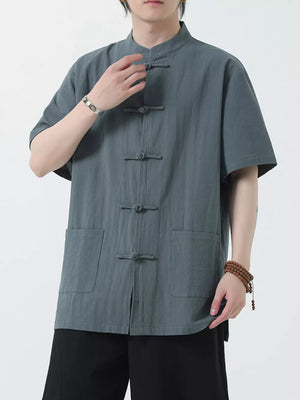 Men's dark gray cotton short-sleeve shirt with mandarin collar and frog button closure.