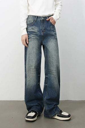 Oversized wide-leg jeans in medium wash denim with distressed details and a relaxed fit.