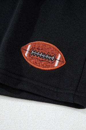 Black cotton sweatshirt with embroidered football detail.