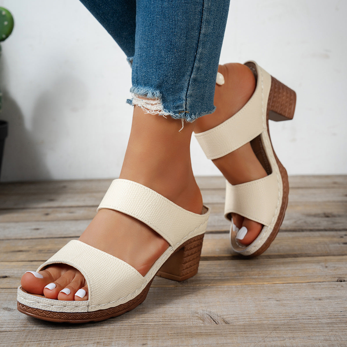 Beige textured strap block heel sandals with a wooden-look heel and platform sole.