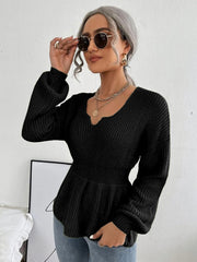 Black peplum knit sweater with scallop neckline and balloon sleeves.