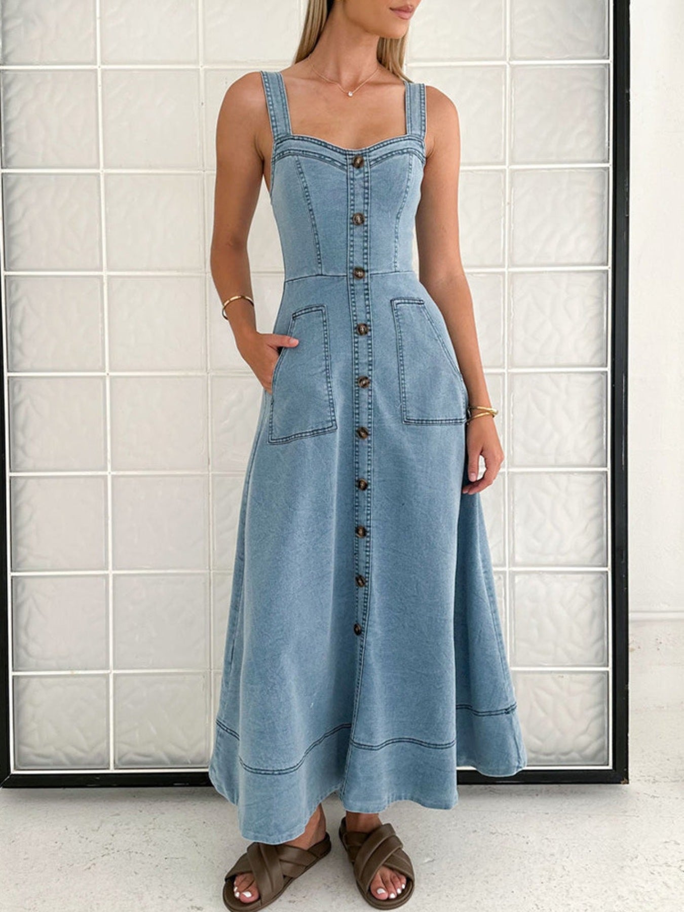 Chic light wash denim A-line midi dress with button front, square neckline, and patch pockets.