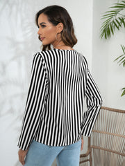 Vertical stripe blouse with long sleeves and a keyhole neckline, shown in black and white.