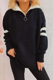 Black ribbed knit quarter-zip sweater with white stripes on sleeves and collar.