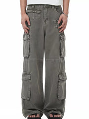 Men's grey distressed cargo pants with multiple utility pockets and a relaxed fit.