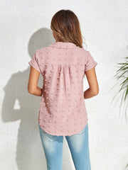 Blush pink textured dot poplin shirt with short sleeves and a collared neckline.