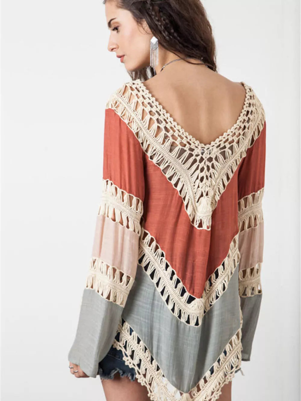 Crochet-trimmed long sleeve cardigan in colorblock with cutout details.