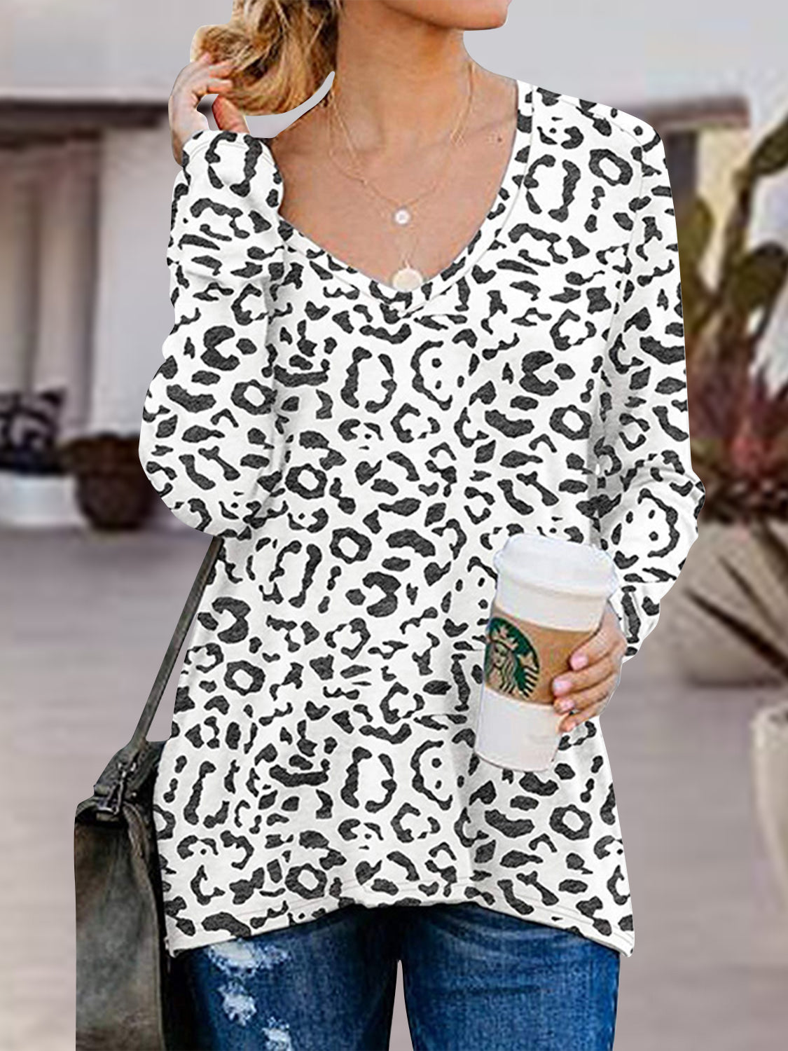 White leopard print V-neck long sleeve top with side zip detail