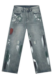 Ink-Blot Wide Leg Denim jeans in medium wash feature abstract paint splatters and distressed details.