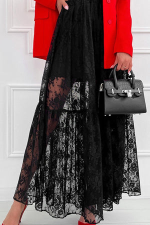 Black floral lace maxi skirt with tiered ruffles and sheer panels.