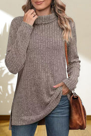 Ribbed knit turtleneck tunic top in heather gray with long sleeves and side slits.