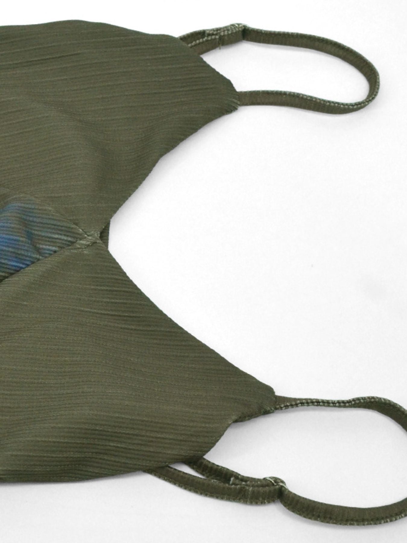 Botanical print spaghetti strap maxi dress in green with textured fabric and blue floral detail.
