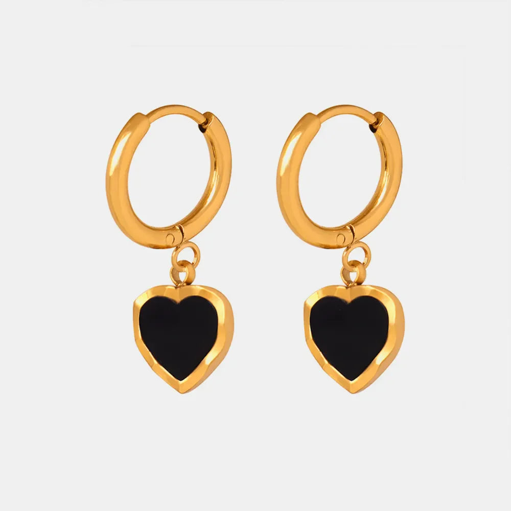 Gold hoop earrings with black enamel heart charms