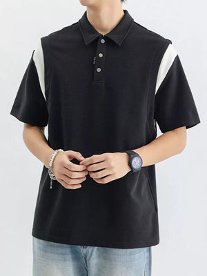 Black cotton polo shirt with contrast white shoulder panels and buttoned placket.