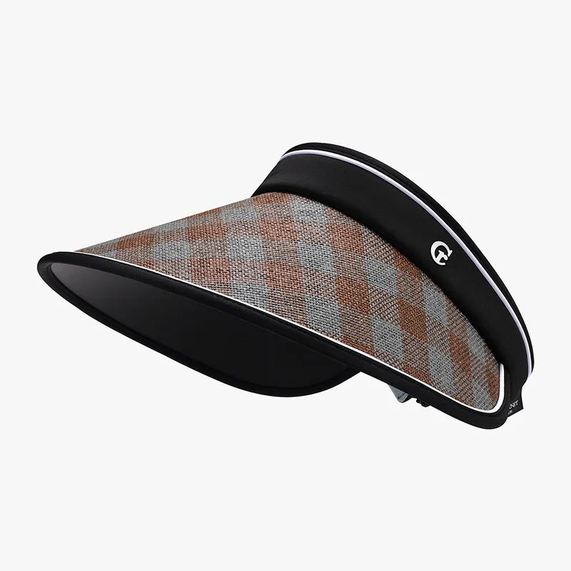 Gingham visor with adjustable strap in brown and grey plaid, featuring a black band and white trim.