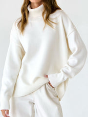 White relaxed roll-neck sweater with a boxy knit and ribbed cuffs and hem.