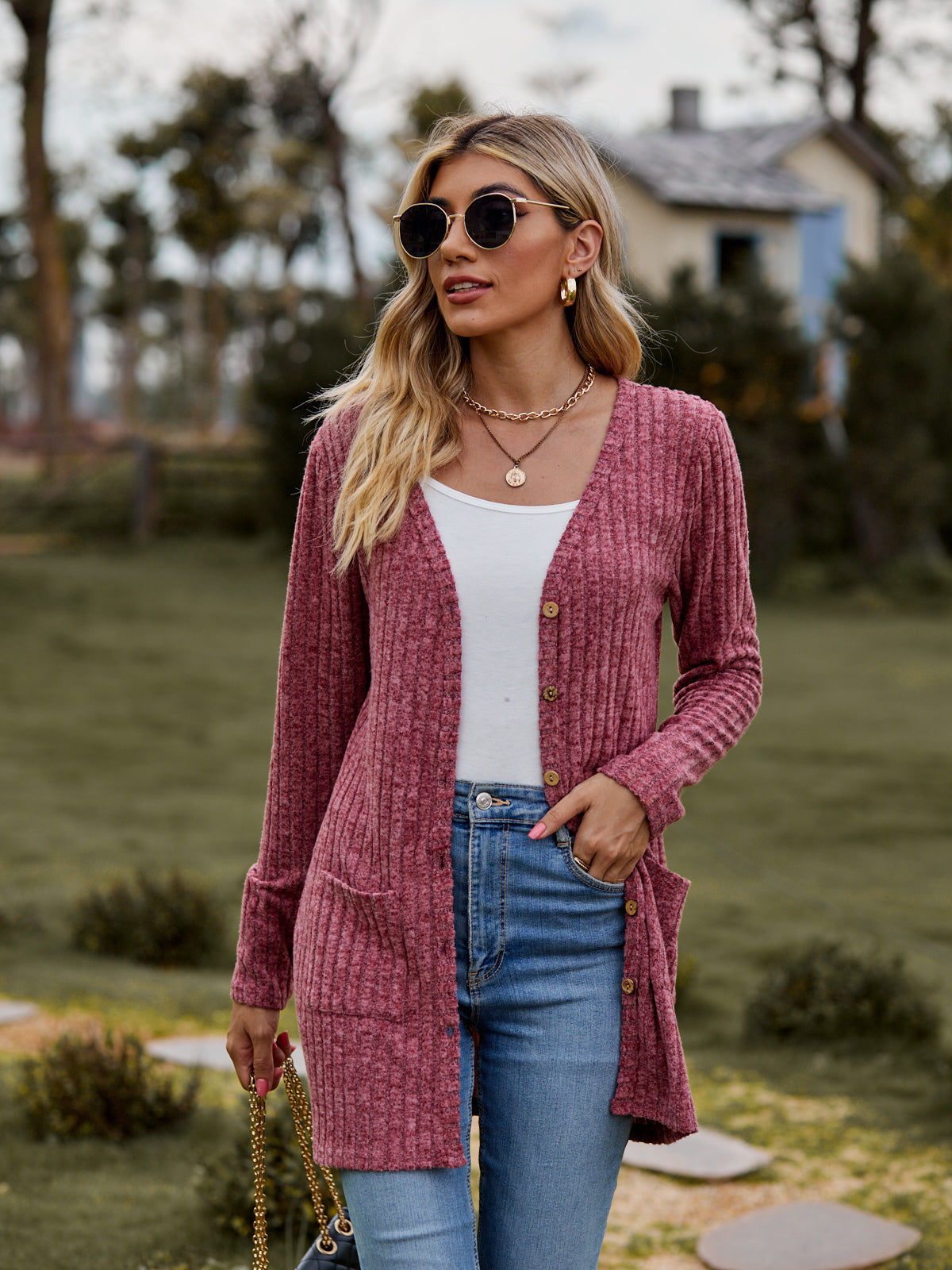 Longline ribbed knit button-down cardigan in Rust with pockets.