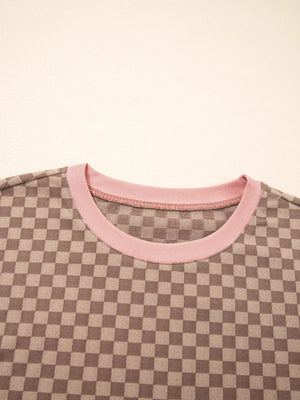 Chic checkerboard loungewear top with pink trim and crew neck.