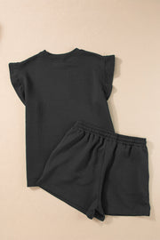 Black textured loungewear set with flutter sleeve top and drawstring shorts.