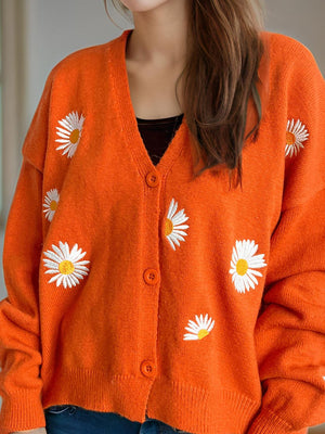 Orange acrylic oversized knit cardigan with embroidered daisies and buttons