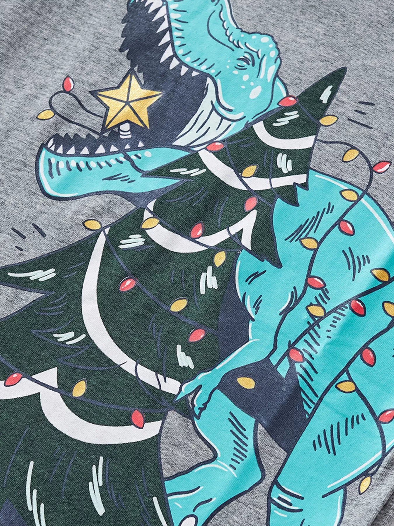 Gray cotton t-shirt with a dinosaur tangled in Christmas lights graphic.