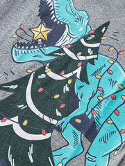 Gray cotton t-shirt with a dinosaur tangled in Christmas lights graphic.