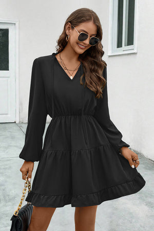 Black tiered ruffle sleeve mini dress with v-neck and tie detail