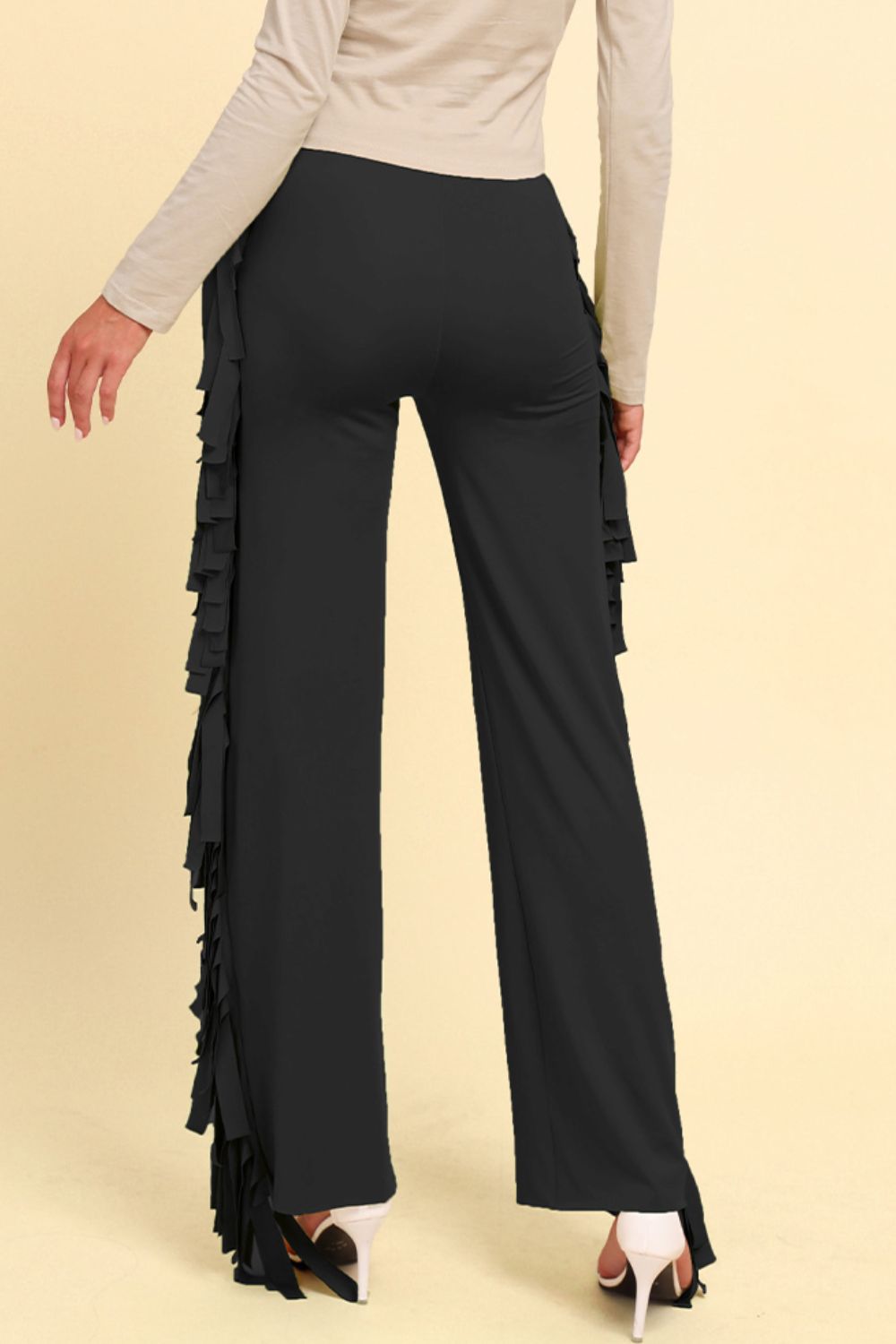 Black palazzo trousers with cascading fringe detail on the side.