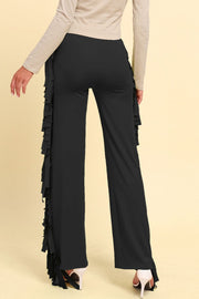 Black palazzo trousers with cascading fringe detail on the side.