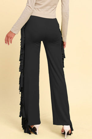 Black palazzo trousers with cascading fringe detail on the side.