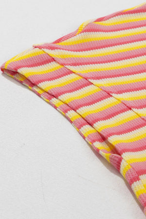 Rainbow stripe culotte jumpsuit in pink, yellow, and white cotton knit.