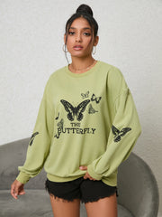 Lime oversized sweatshirt with black butterfly graphic and text.