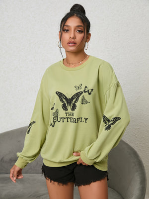 Lime oversized sweatshirt with black butterfly graphic and text.