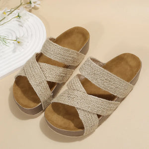 Braided strap platform slides in camel with crisscross straps and cork footbed.