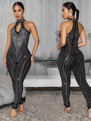 Black rhinestone halter neck romper with keyhole cutout and full length legs.