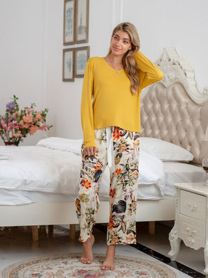 Yellow long sleeve top with botanical print lounge pants and white tie waist