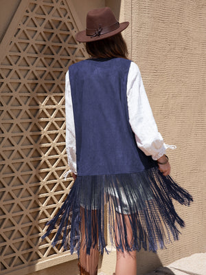 Navy faux suede vest with fringe detail and embroidered accents.