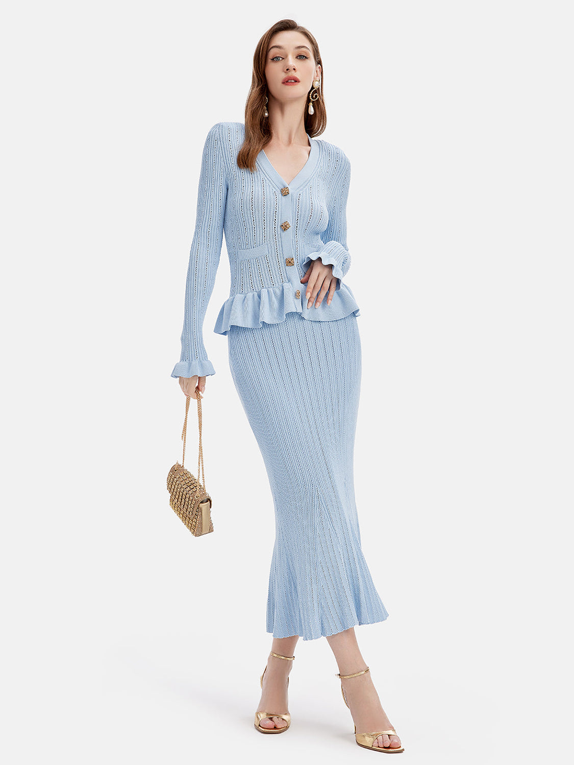 Light blue knit cardigan with ruffled hem and matching mermaid skirt.