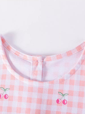 Baby dress with pink gingham and cherry embroidery, cotton fabric.