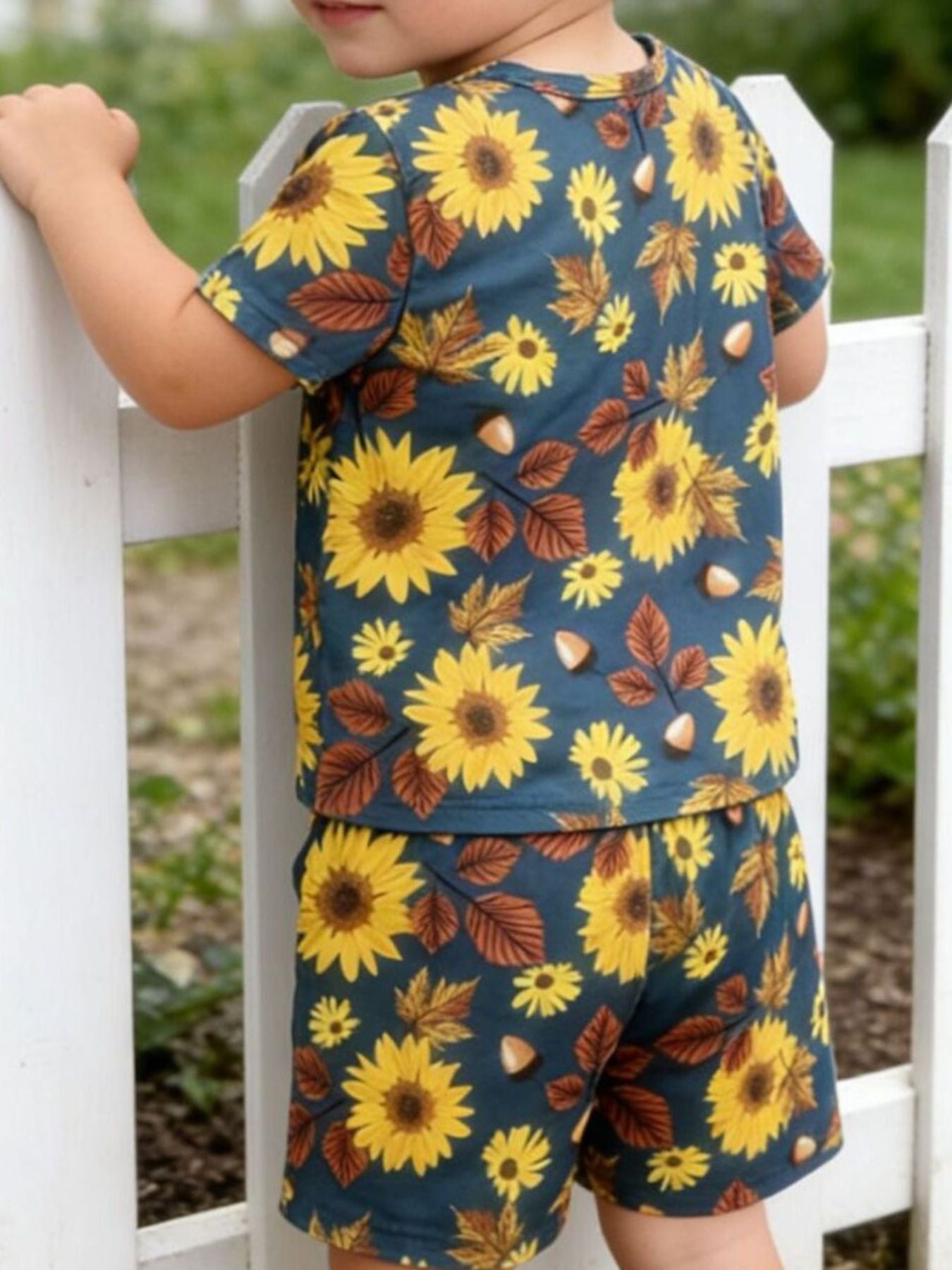 Baby girls' short sleeve top and shorts set with sunflower and autumn leaf print.